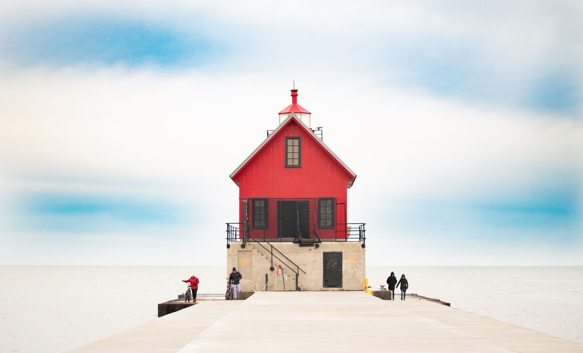 The red Grand Haven lighthouse on the Lake Michigan pier