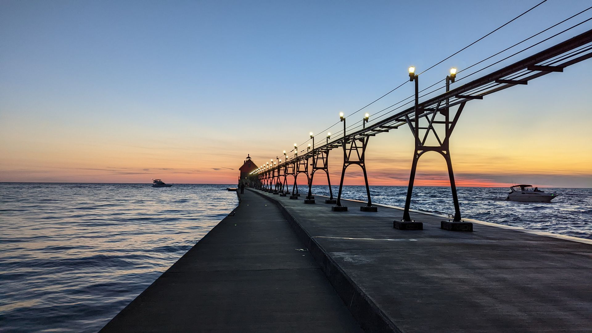 The Grand Haven pier and catwalk at sunset on Lake Michigan