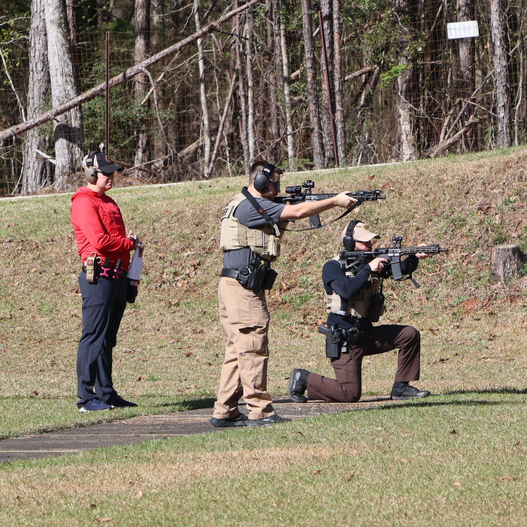 Deputies practicing rifle drills on the firing range with an instructor observing