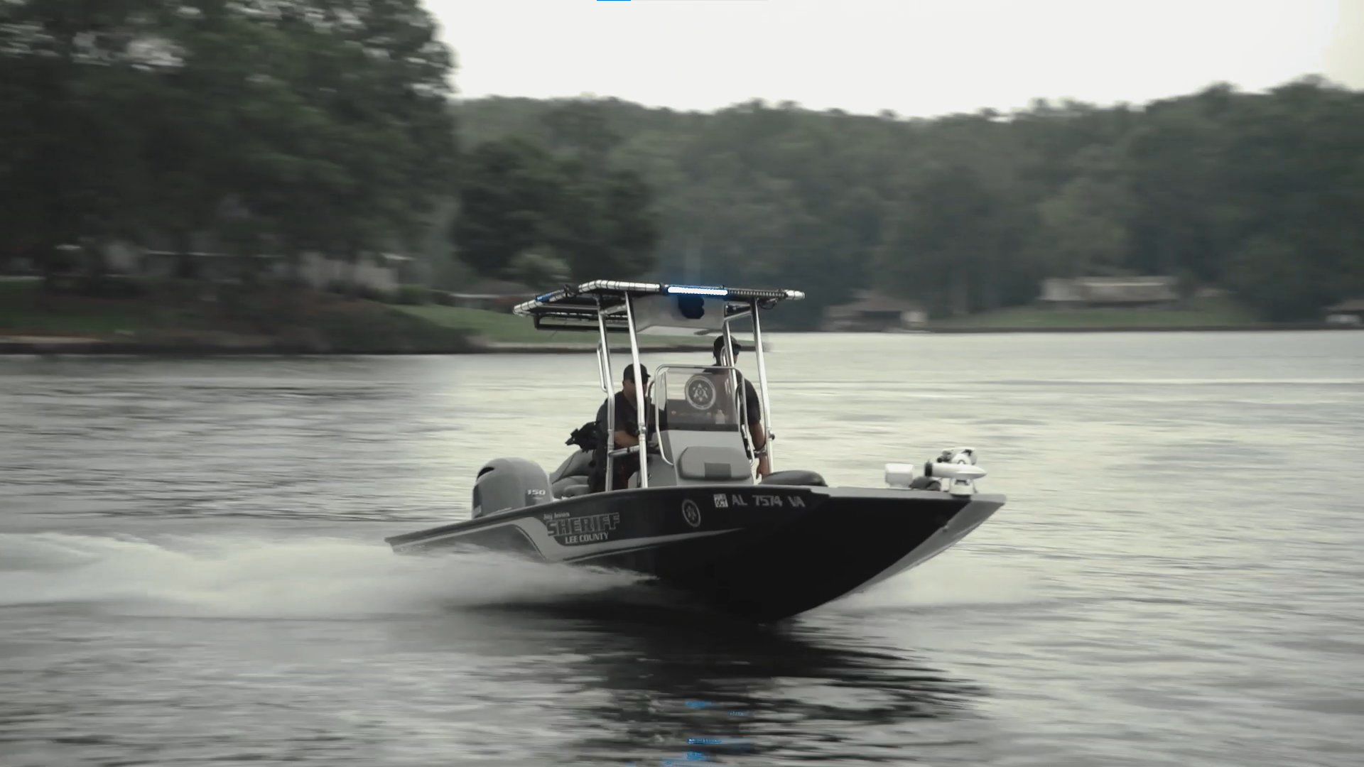 Sheriff's patrol boat underway on a lake with two deputies aboard