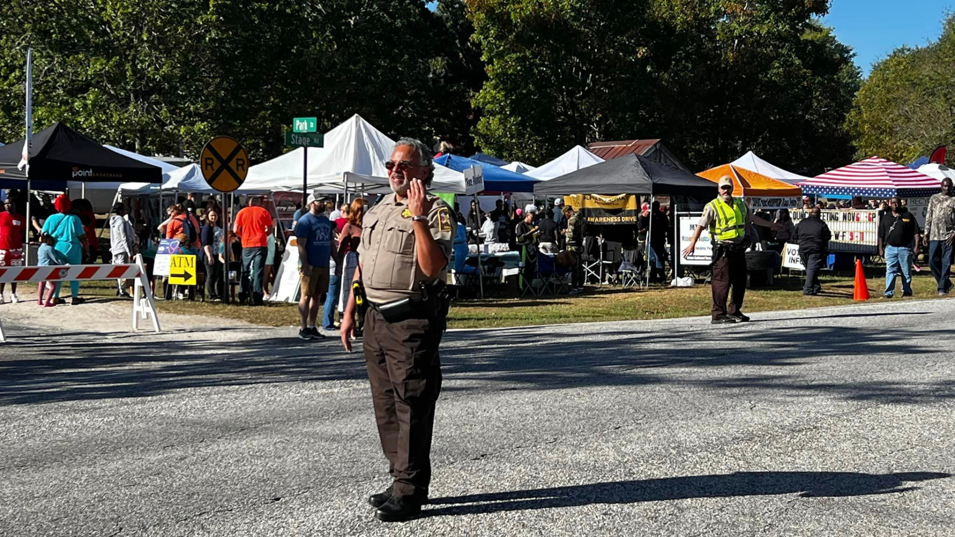 Deputy directing traffic at a community festival