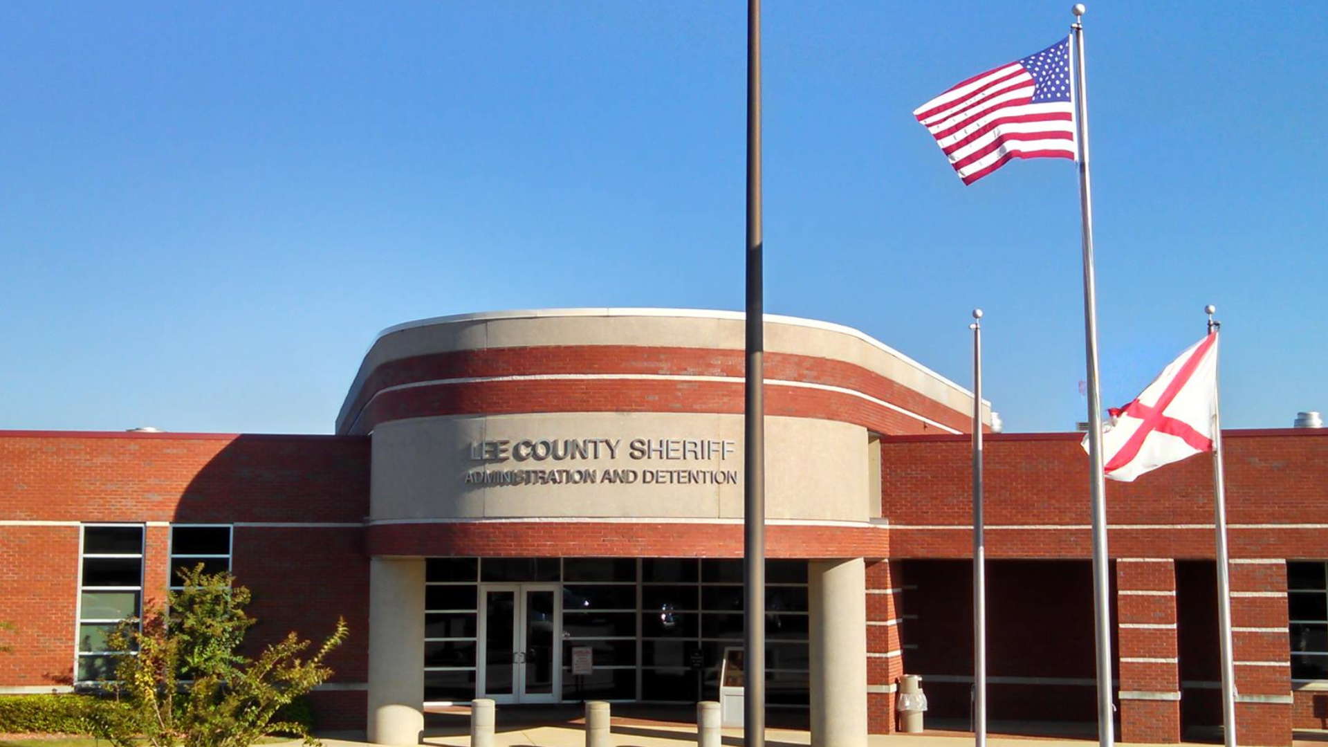 Lee County Sheriff Administration and Detention building with the American and Alabama flags out front