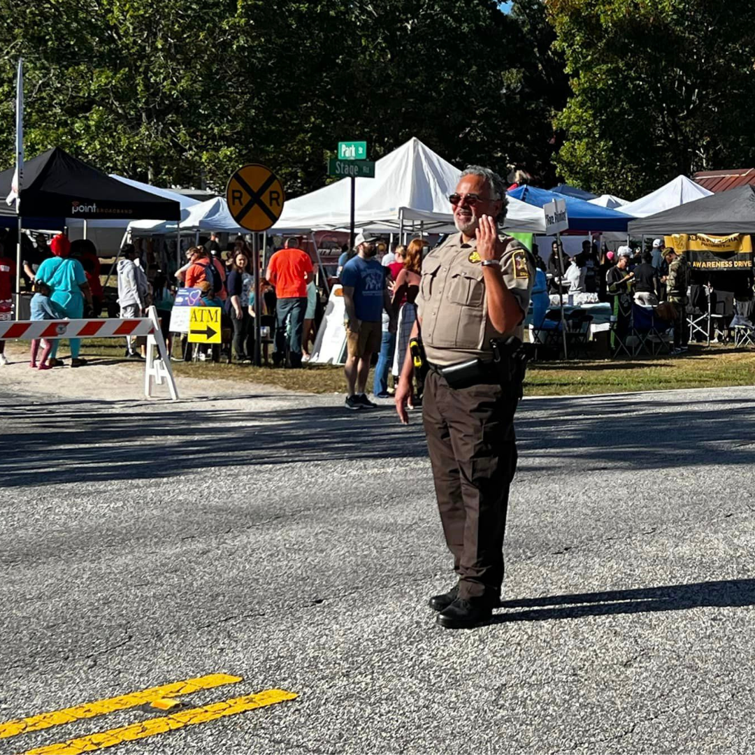 Deputy directing traffic at a community festival